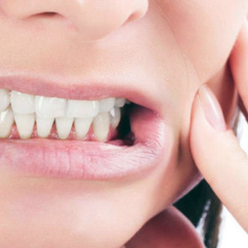 Close-up of person showing teeth