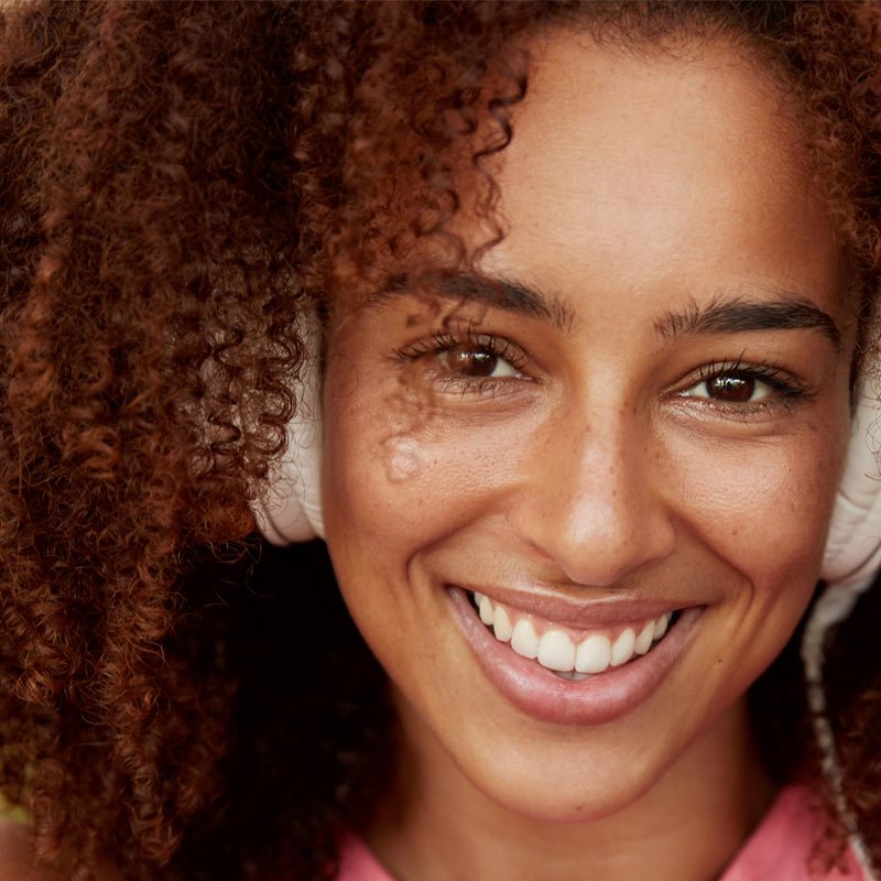 Happy woman listening to music