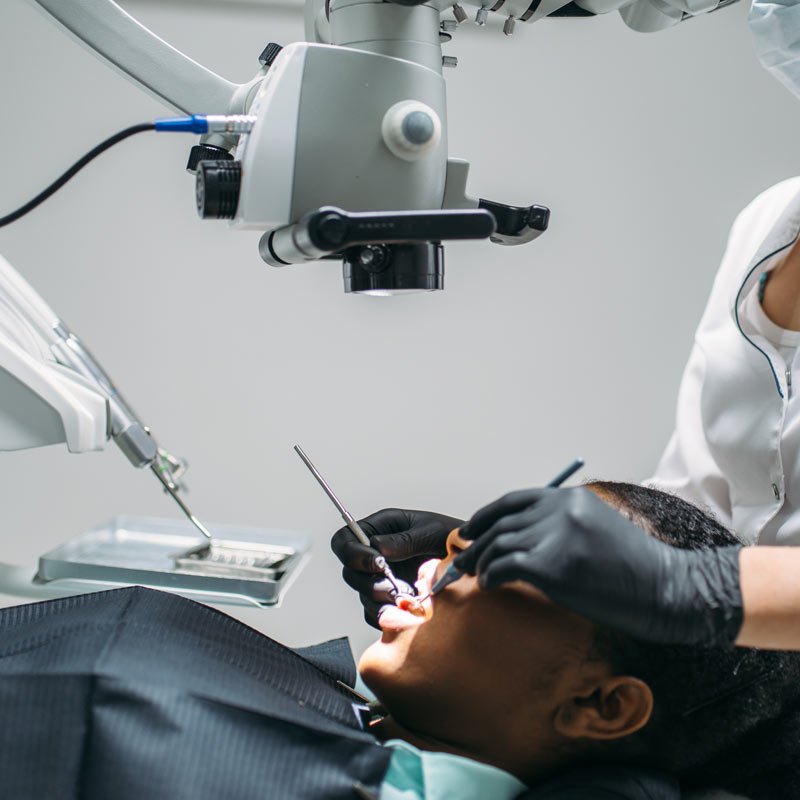 Patient receiving dental care in clinic.